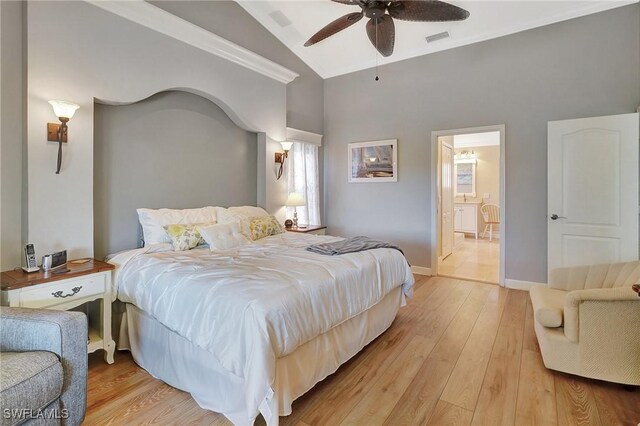 bedroom with lofted ceiling, ceiling fan, and light hardwood / wood-style flooring