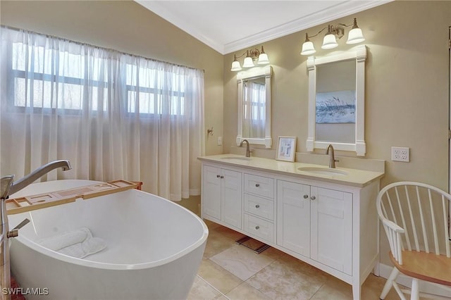 bathroom with crown molding, tile patterned floors, vanity, and a tub