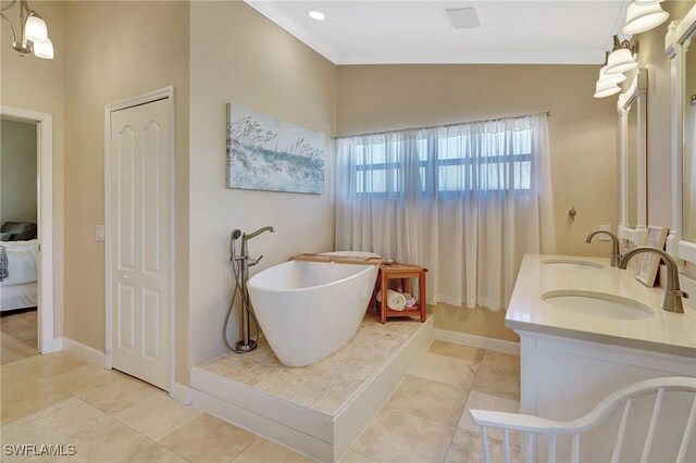 bathroom with vanity, vaulted ceiling, tile patterned floors, and a tub to relax in