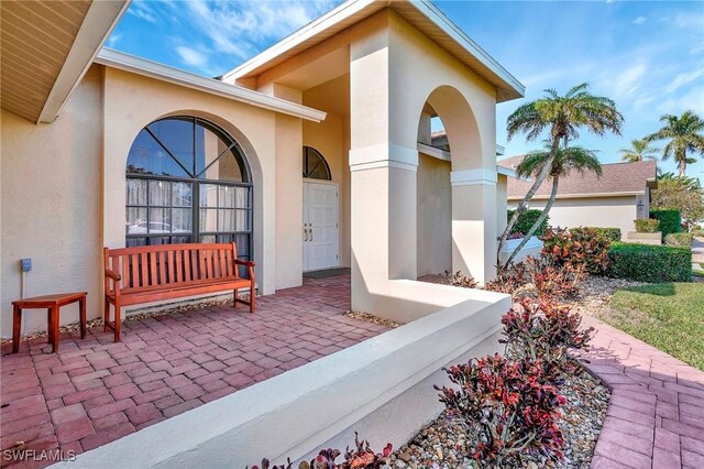 property entrance with a patio area