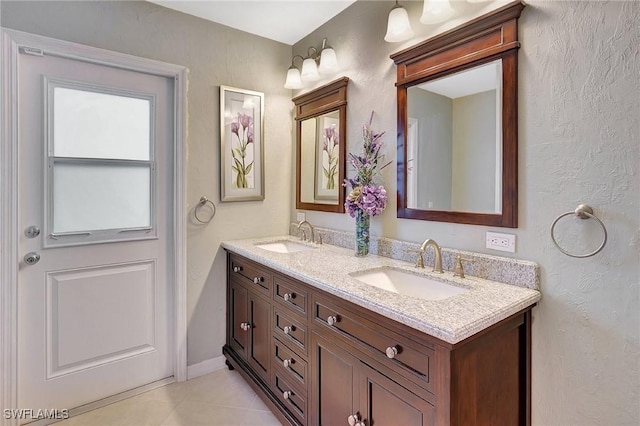 bathroom with vanity and tile patterned floors