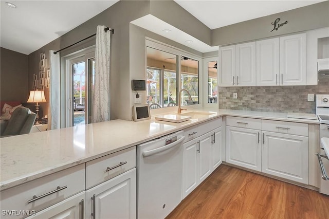 kitchen featuring white cabinetry, plenty of natural light, and dishwasher