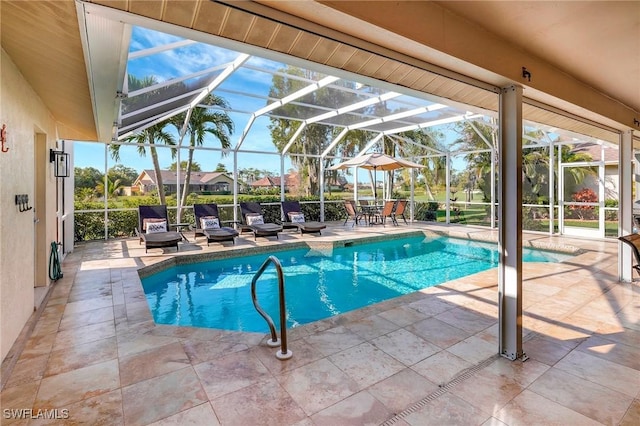 view of pool with a patio and a lanai