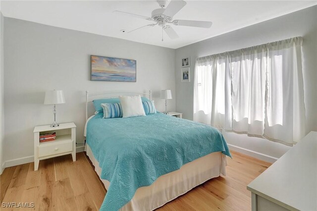 bedroom featuring ceiling fan and light hardwood / wood-style floors