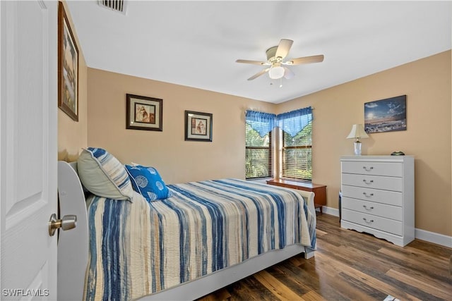 bedroom featuring dark hardwood / wood-style flooring and ceiling fan