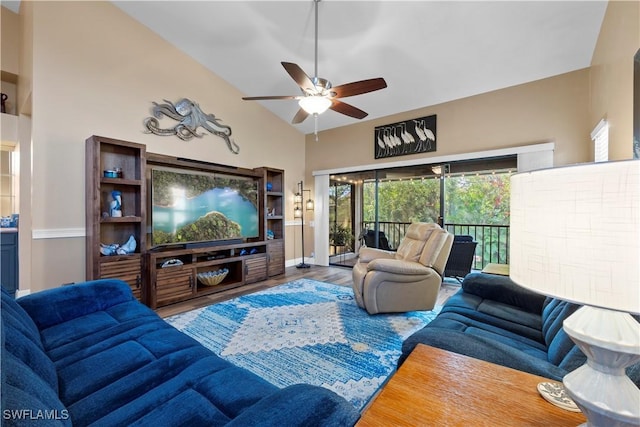 living room featuring hardwood / wood-style flooring, ceiling fan, and vaulted ceiling