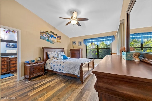 bedroom featuring ceiling fan, lofted ceiling, and dark hardwood / wood-style floors