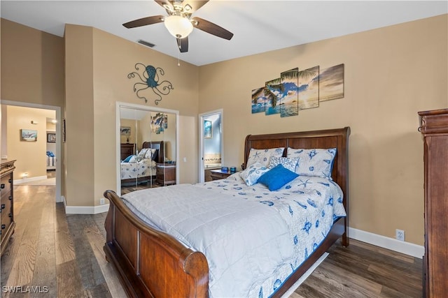 bedroom with dark hardwood / wood-style floors and ceiling fan