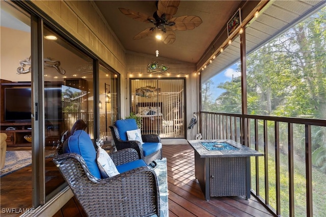 sunroom / solarium featuring vaulted ceiling and ceiling fan