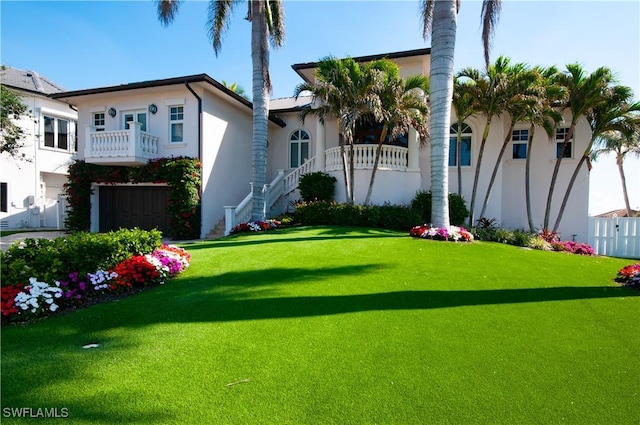 view of yard with a balcony