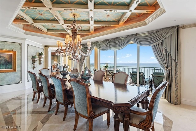 dining room featuring crown molding, an inviting chandelier, a water view, coffered ceiling, and ornate columns