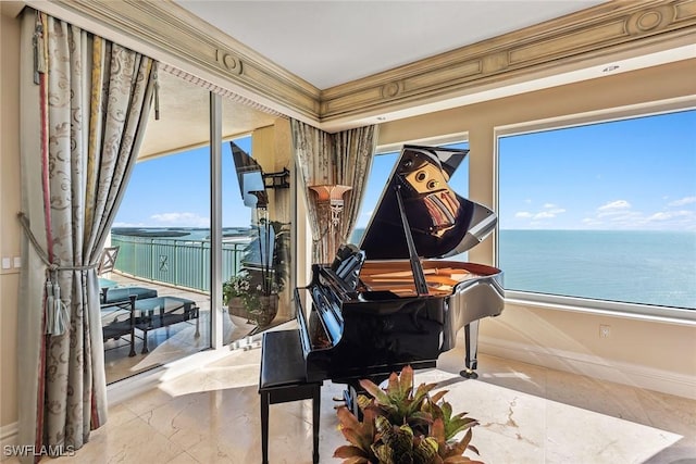 misc room with crown molding, a water view, and a wealth of natural light