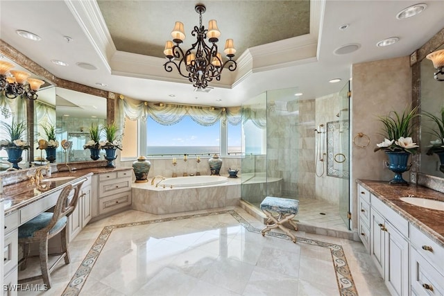 bathroom with vanity, a tray ceiling, ornamental molding, and plus walk in shower