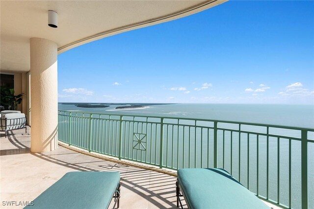 balcony featuring a water view