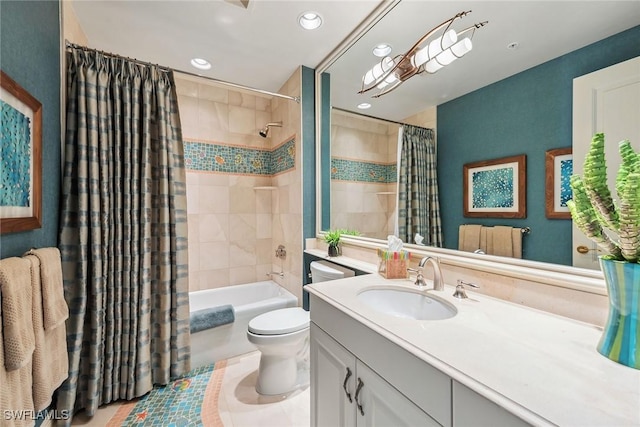 full bathroom featuring toilet, vanity, and shower / bathtub combination with curtain