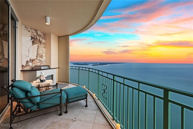 balcony at dusk with a water view