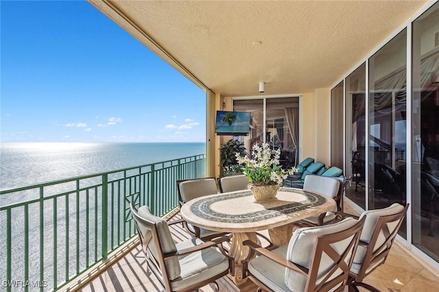 balcony featuring a water view