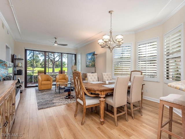 dining space featuring crown molding, ceiling fan with notable chandelier, baseboards, and light wood-style floors