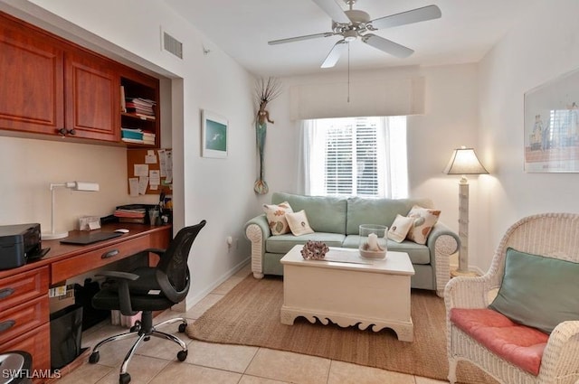 home office with ceiling fan and light tile patterned floors