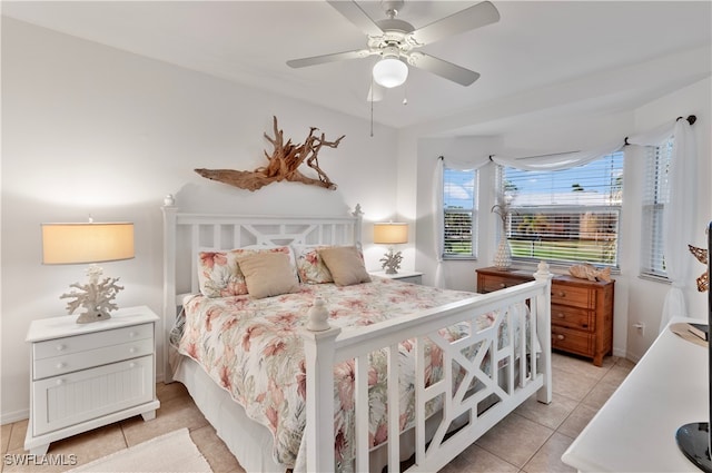 tiled bedroom with ceiling fan