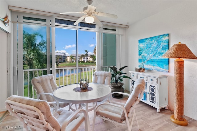 sunroom / solarium with ceiling fan