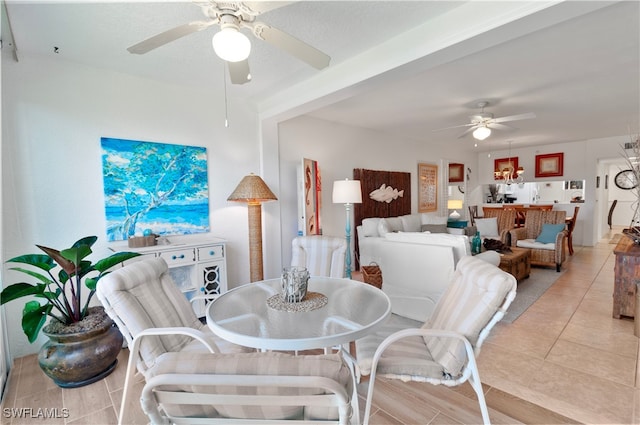 dining room with ceiling fan and light tile patterned floors