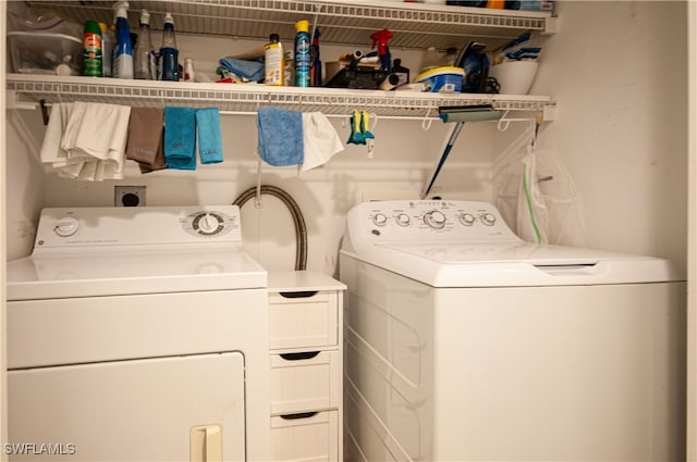 laundry room with washer and dryer