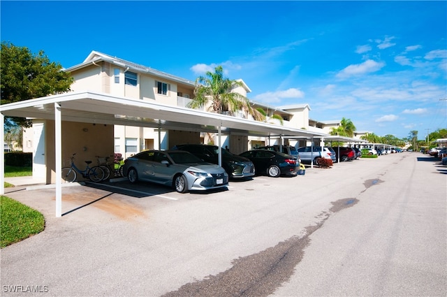 view of parking / parking lot with a carport