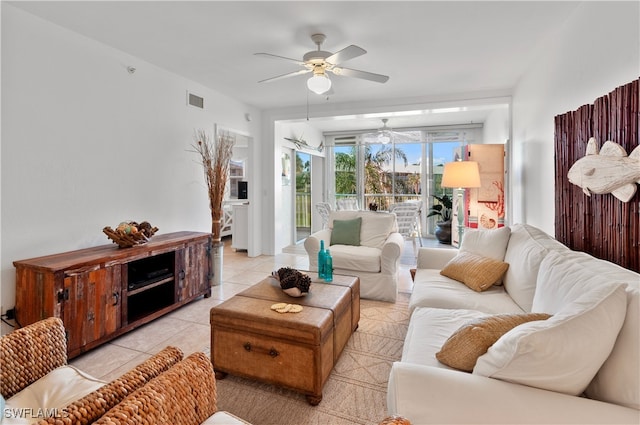 living room with light tile patterned flooring and ceiling fan