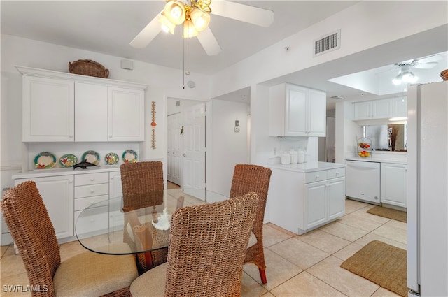 dining area featuring ceiling fan and light tile patterned flooring