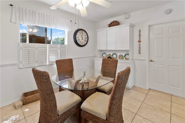 dining space with light tile patterned floors and ceiling fan