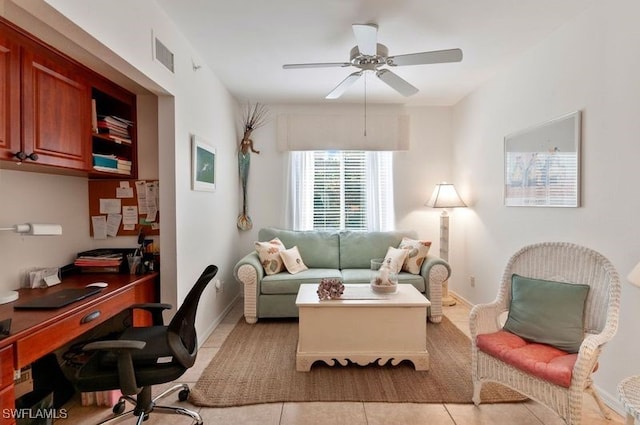 tiled living room featuring ceiling fan