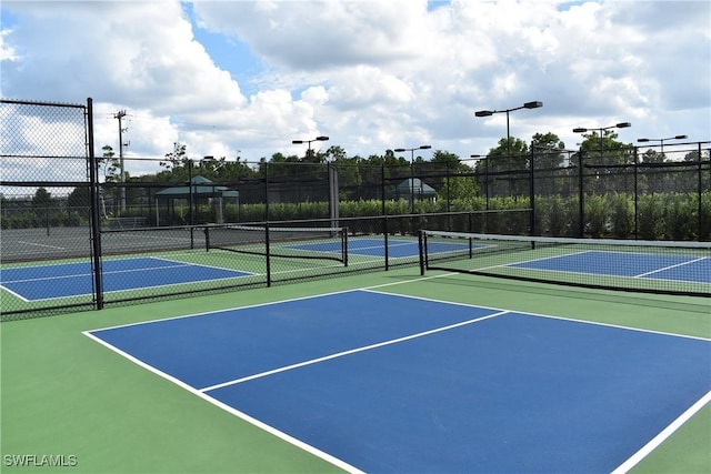 view of sport court featuring basketball hoop