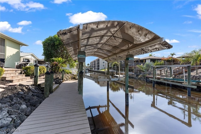 view of dock featuring a water view and boat lift