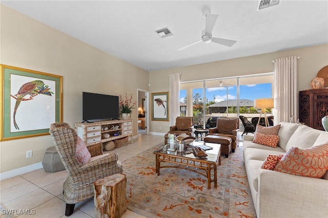 living room featuring light tile patterned floors, ceiling fan, and visible vents