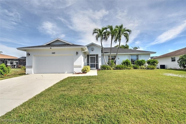 ranch-style home with a garage and a front yard