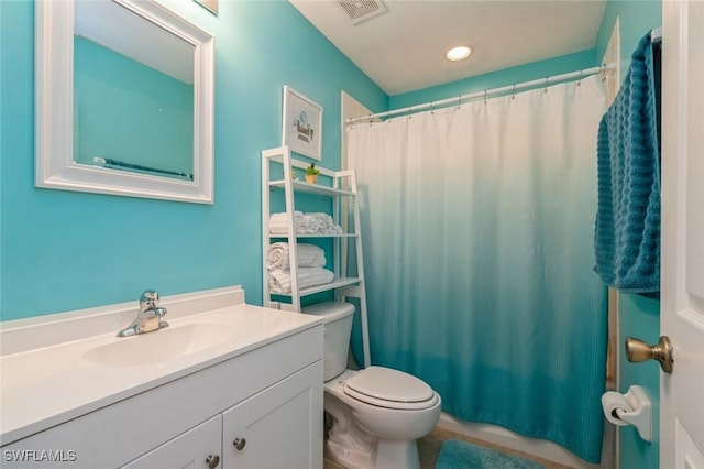 full bathroom with vanity, shower / bath combination with curtain, and toilet