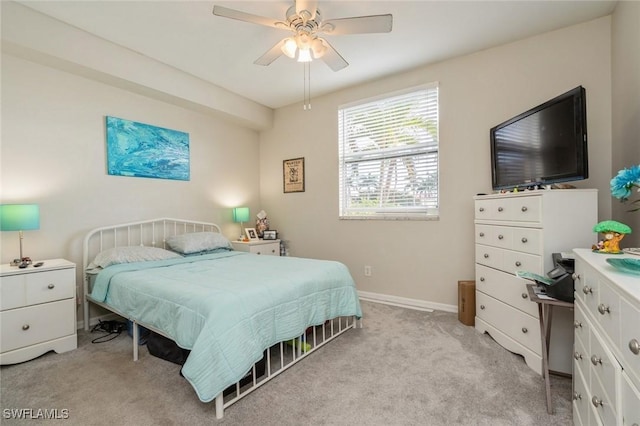 bedroom with light colored carpet and ceiling fan