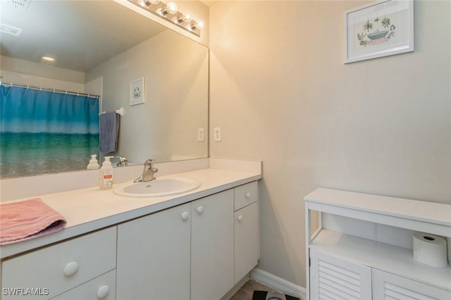 bathroom with vanity and a shower with shower curtain