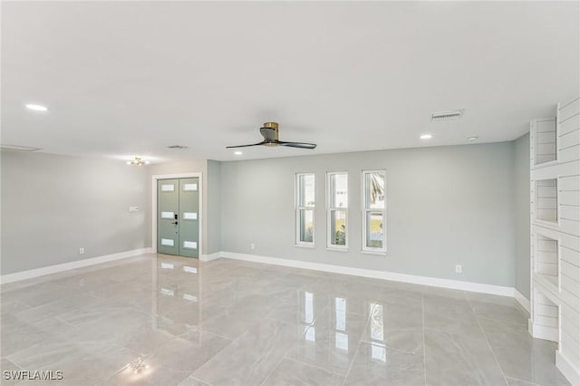 empty room featuring baseboards, visible vents, a ceiling fan, french doors, and recessed lighting