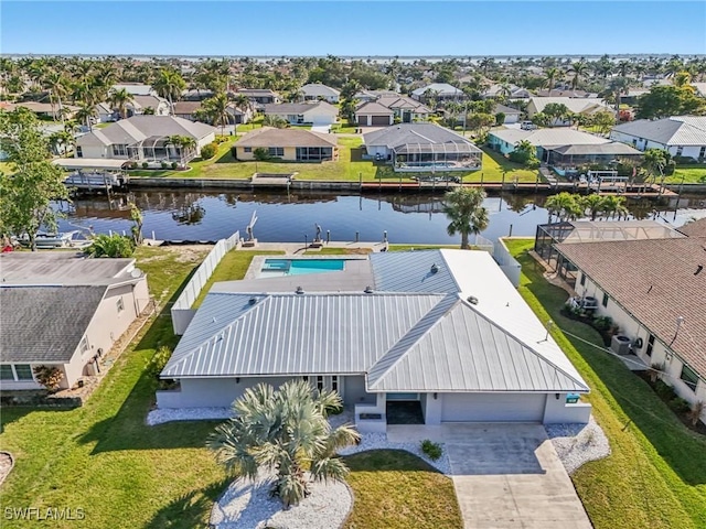 aerial view featuring a residential view and a water view