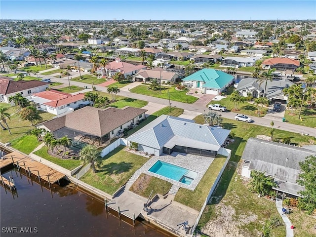 bird's eye view with a residential view and a water view