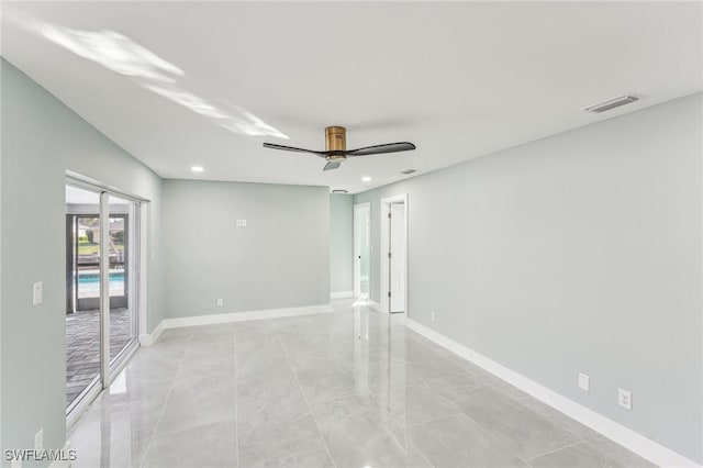 spare room featuring baseboards, visible vents, a ceiling fan, and recessed lighting