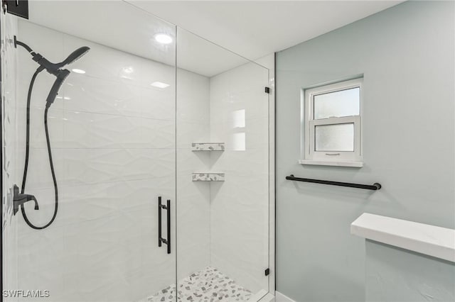 bathroom with a shower stall