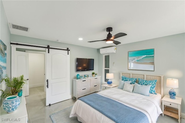 bedroom featuring a barn door, visible vents, a ceiling fan, a wall unit AC, and recessed lighting