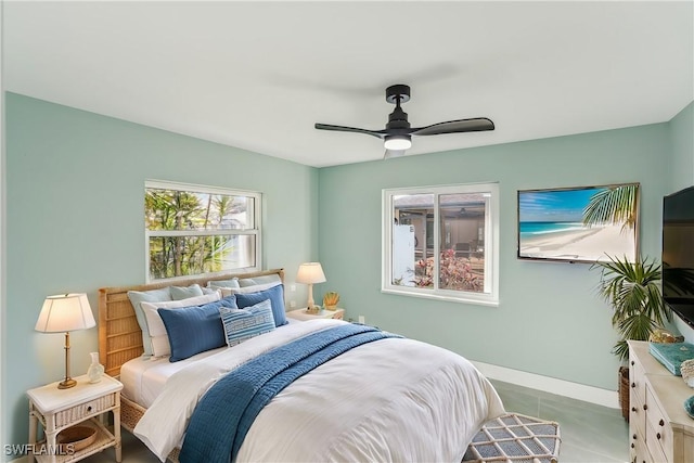 bedroom featuring ceiling fan and baseboards