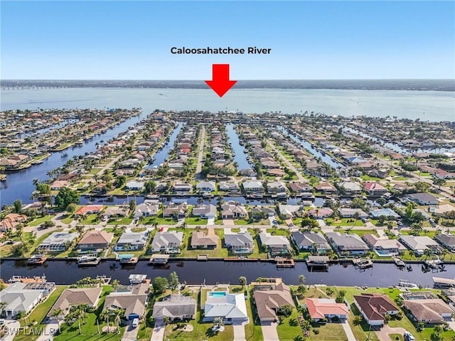 aerial view featuring a water view and a residential view