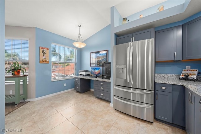 kitchen featuring pendant lighting, light tile patterned floors, light stone countertops, stainless steel fridge with ice dispenser, and vaulted ceiling