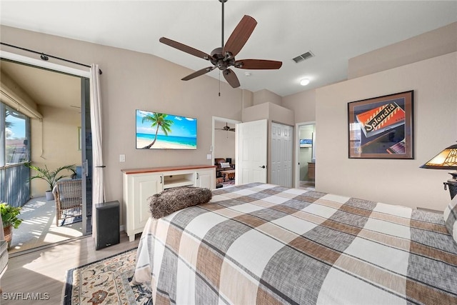 bedroom featuring vaulted ceiling, ceiling fan, light hardwood / wood-style floors, and access to outside