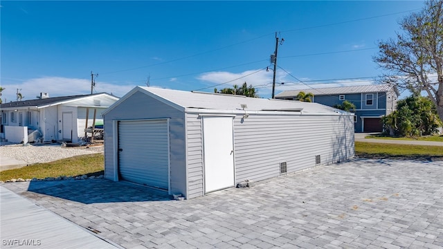 view of outdoor structure with a garage